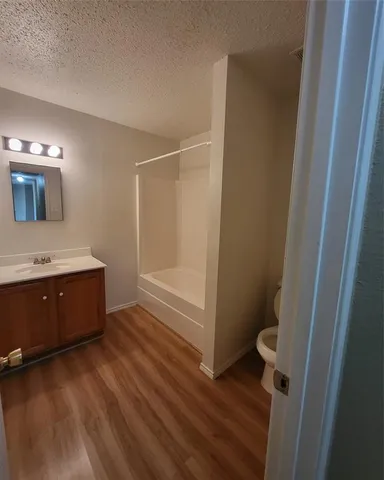 an empty room with a empty space and windows