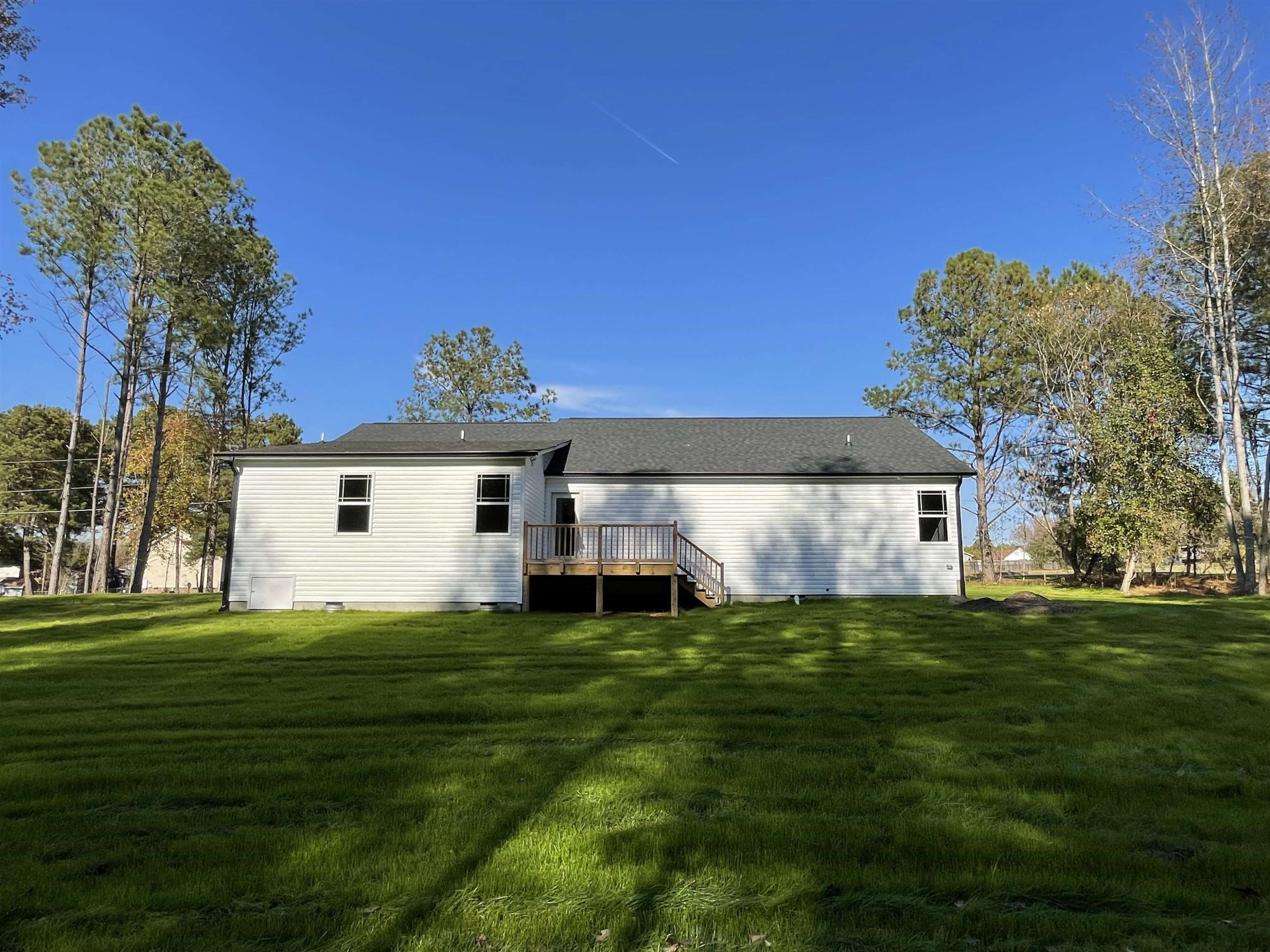 496 Roberts Road Willow Spring, NC 27592 - Photo 14 of 15 a big white house with a yard