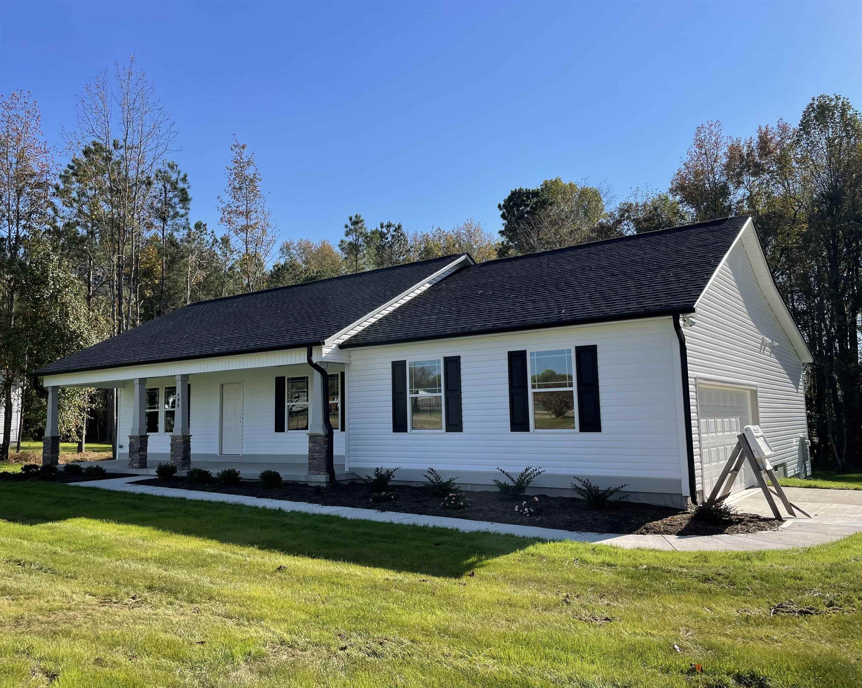496 Roberts Road Willow Spring, NC 27592 - Photo 2 of 15 a view of a house with a swimming pool and a yard