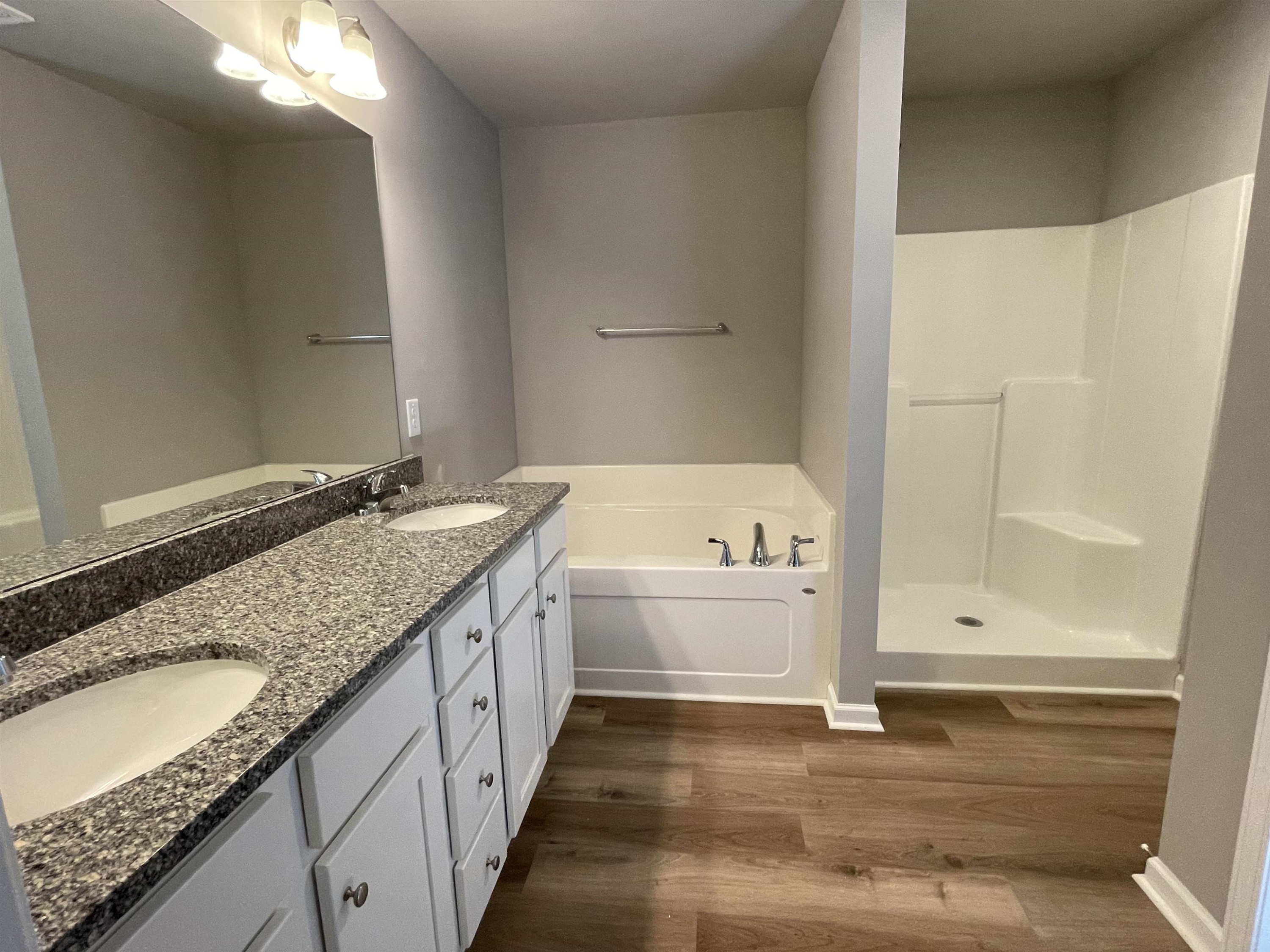 496 Roberts Road Willow Spring, NC 27592 - Photo 7 of 15 a bathroom with a granite countertop sink and a mirror