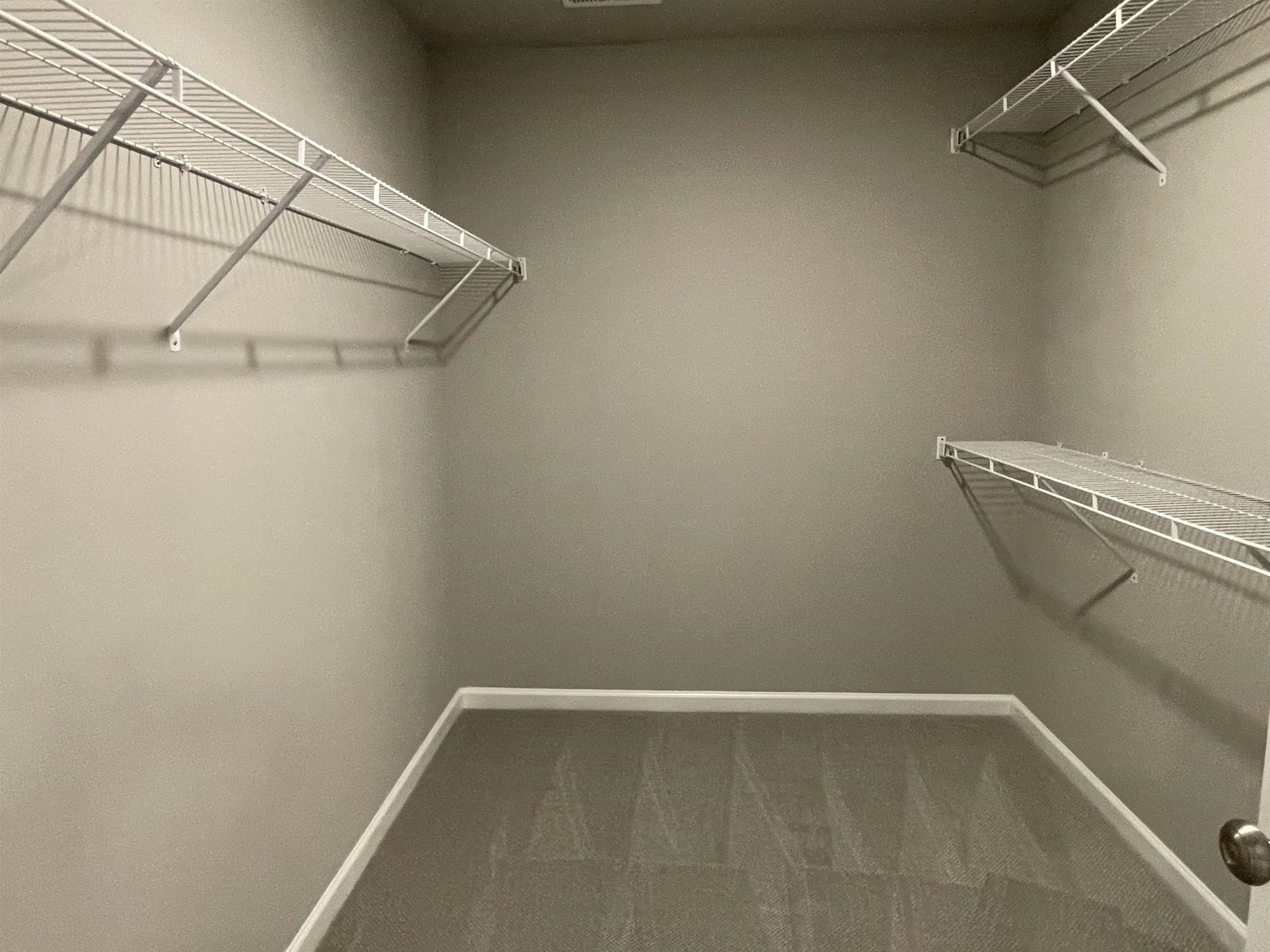 496 Roberts Road Willow Spring, NC 27592 - Photo 8 of 15 a view of a room with racks on the wall