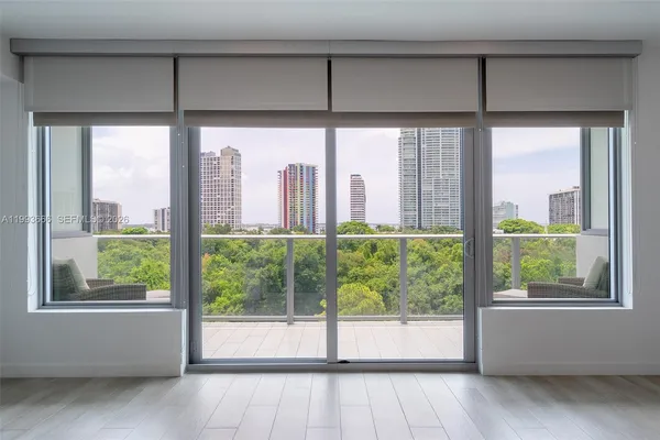a view of a room that has a bed and a window
