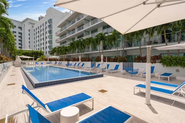 a view of a swimming pool with sitting area