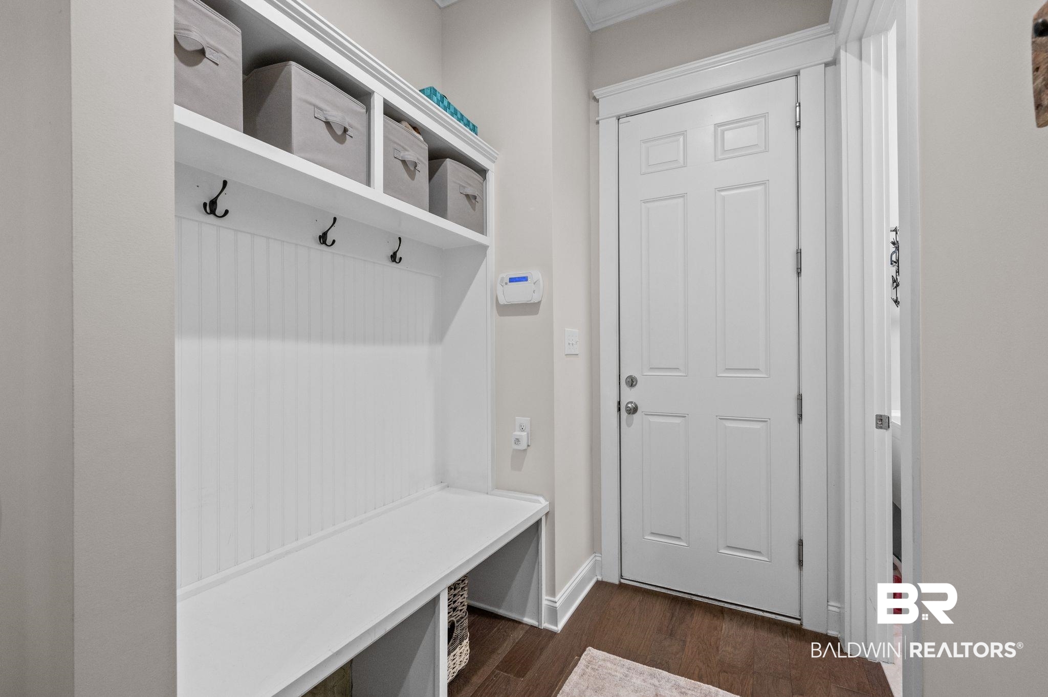 32194 Badger Court Daphne, AL 36527 - Photo 37 of 49 Mudroom featuring dark wood-style floors and baseboards