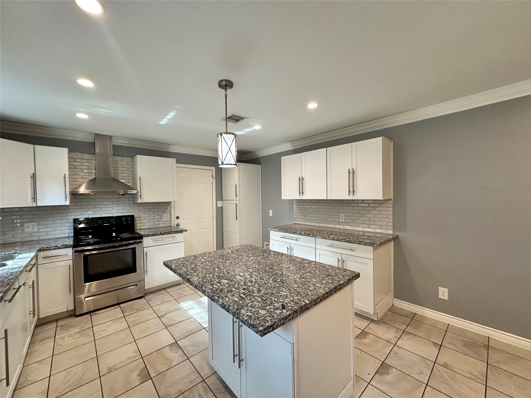 2206 South Houston Road Pasadena, TX 77502 - Photo 3 of 11 a kitchen with stainless steel appliances granite countertop a sink stove and cabinets