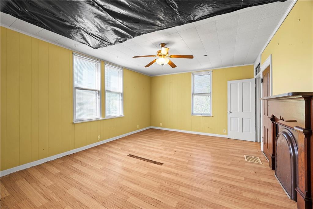 1276 Willowbrook Road Rostraver Township, PA 15012 - Photo 16 of 40 a view of empty room with wooden floor and fan