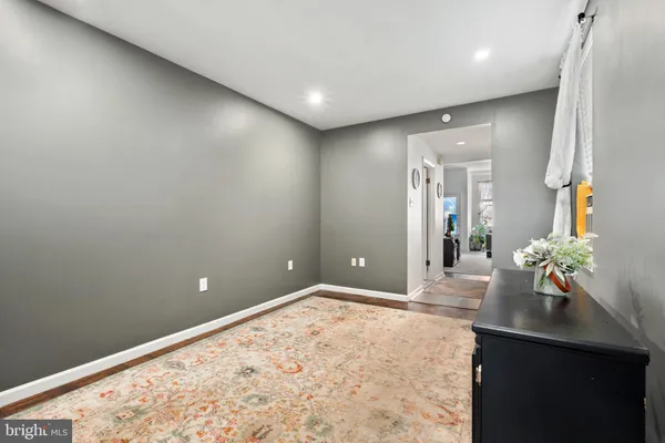 a kitchen with stainless steel appliances granite countertop a refrigerator a stove top oven a sink and dishwasher