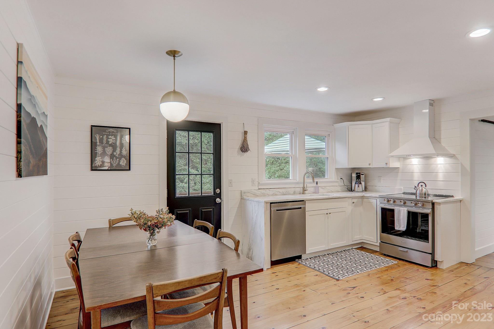 290 Upper Brush Creek Road Fletcher, NC 28732 - Photo 11 of 48 a view of kitchen with cabinets and wooden floor