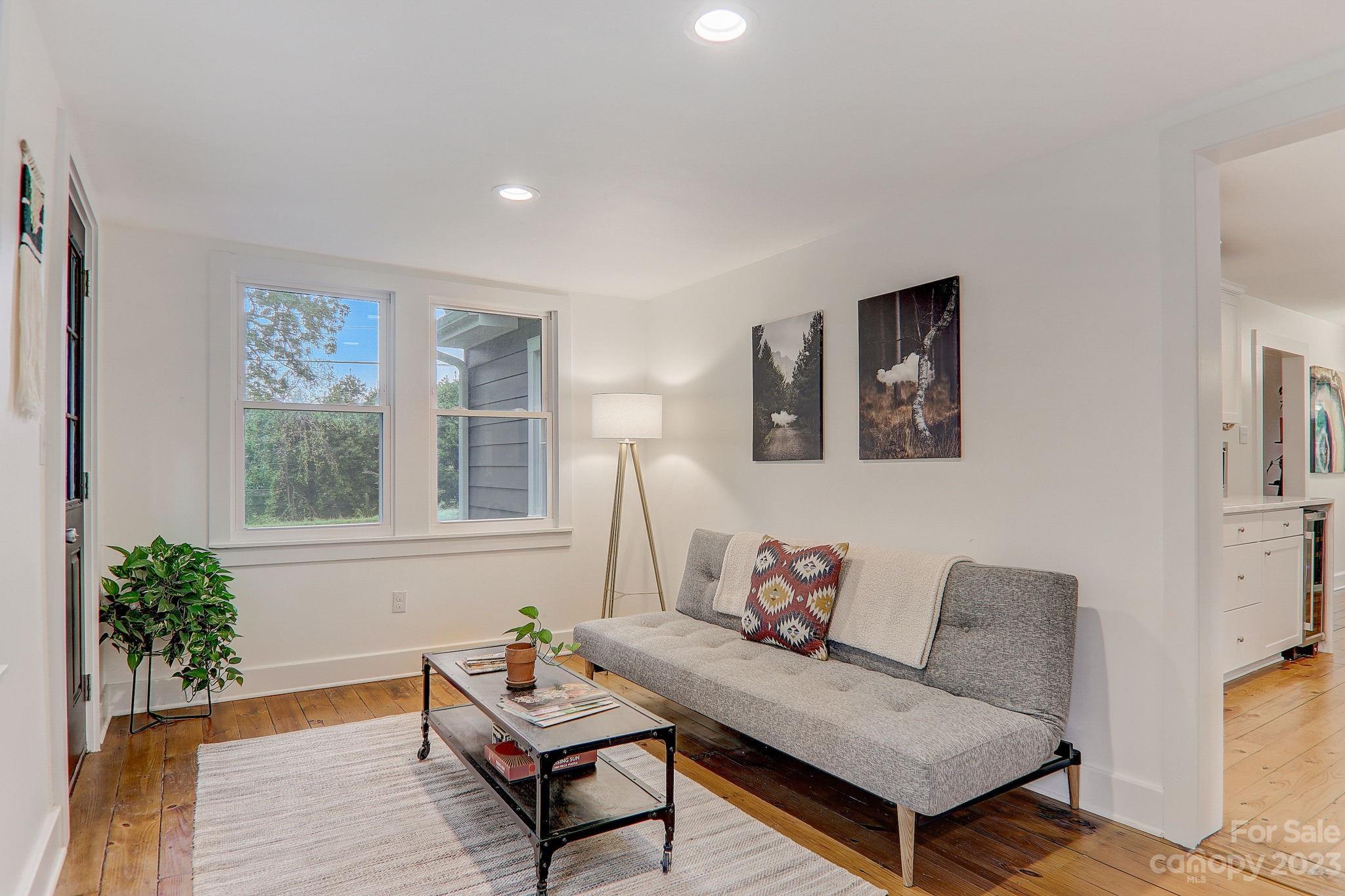 290 Upper Brush Creek Road Fletcher, NC 28732 - Photo 19 of 48 a living room with furniture and a potted plant
