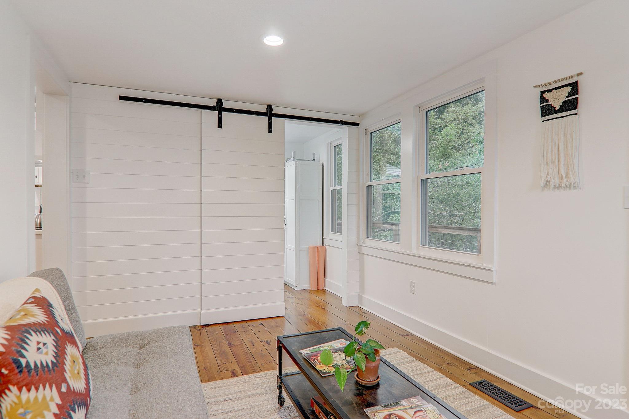 290 Upper Brush Creek Road Fletcher, NC 28732 - Photo 20 of 48 a bathroom with a bathtub and a window