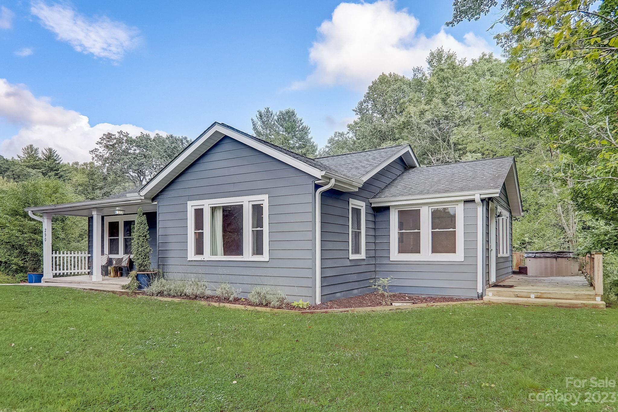 290 Upper Brush Creek Road Fletcher, NC 28732 - Photo 2 of 48 a front view of a house with yard