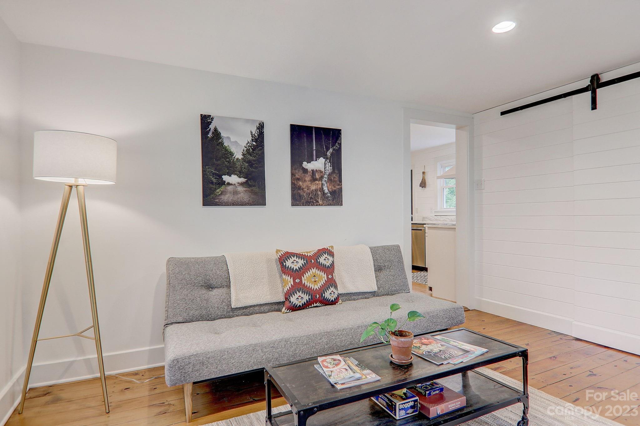 290 Upper Brush Creek Road Fletcher, NC 28732 - Photo 21 of 48 a living room with furniture and a table