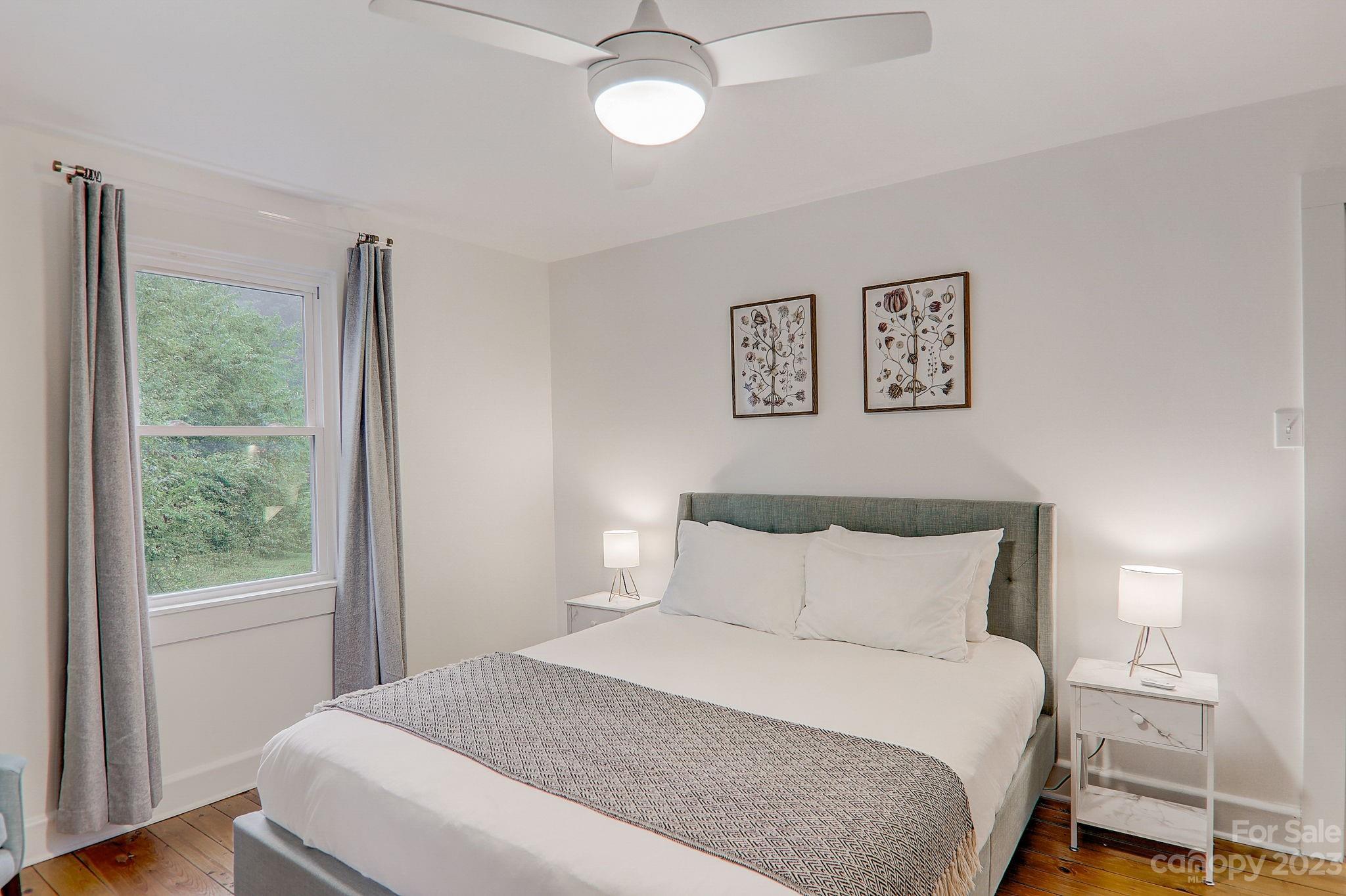 290 Upper Brush Creek Road Fletcher, NC 28732 - Photo 22 of 48 a bedroom with a large bed and a window