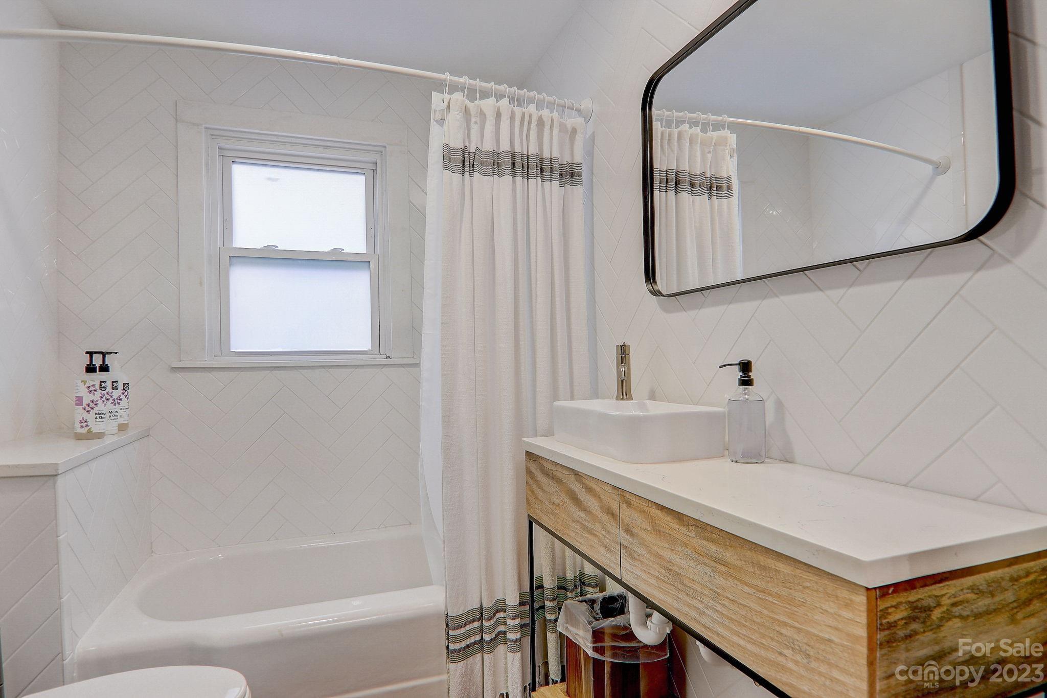 290 Upper Brush Creek Road Fletcher, NC 28732 - Photo 26 of 48 a bathroom with a sink and a mirror