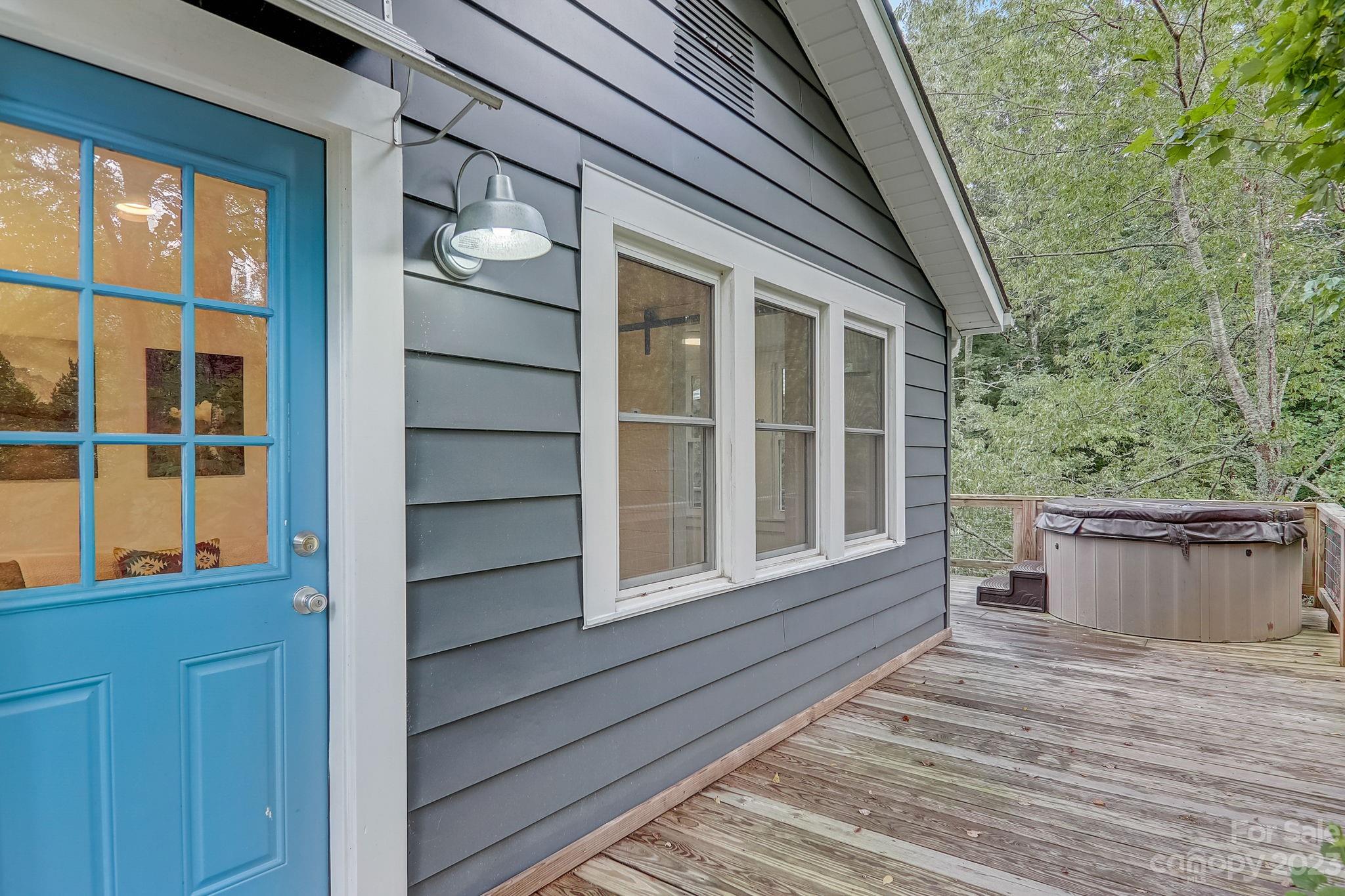 290 Upper Brush Creek Road Fletcher, NC 28732 - Photo 29 of 48 a view of a house with a large window and wooden floor