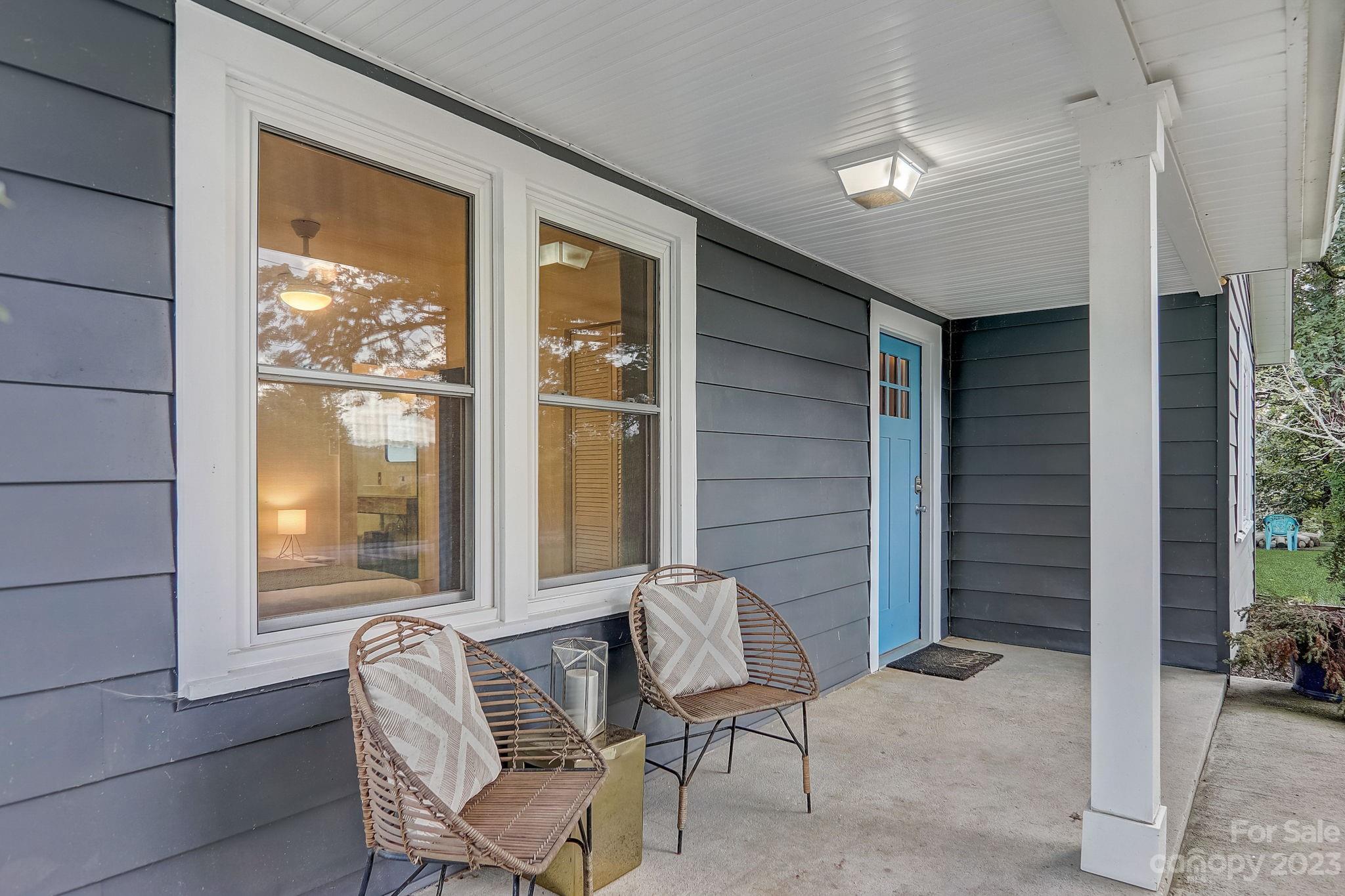 290 Upper Brush Creek Road Fletcher, NC 28732 - Photo 3 of 48 a view of chair and bench in patio