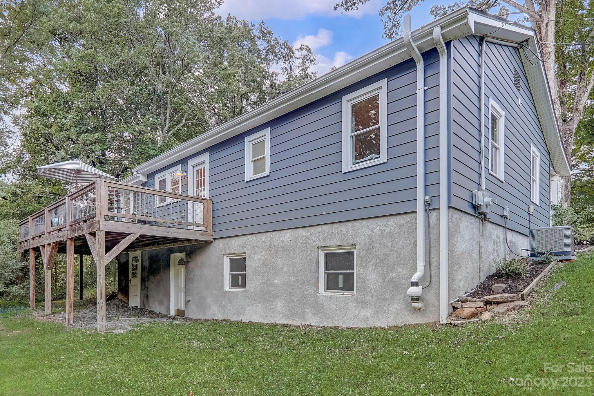 290 Upper Brush Creek Road Fletcher, NC 28732 - Photo 32 of 48 a front view of a house with garden