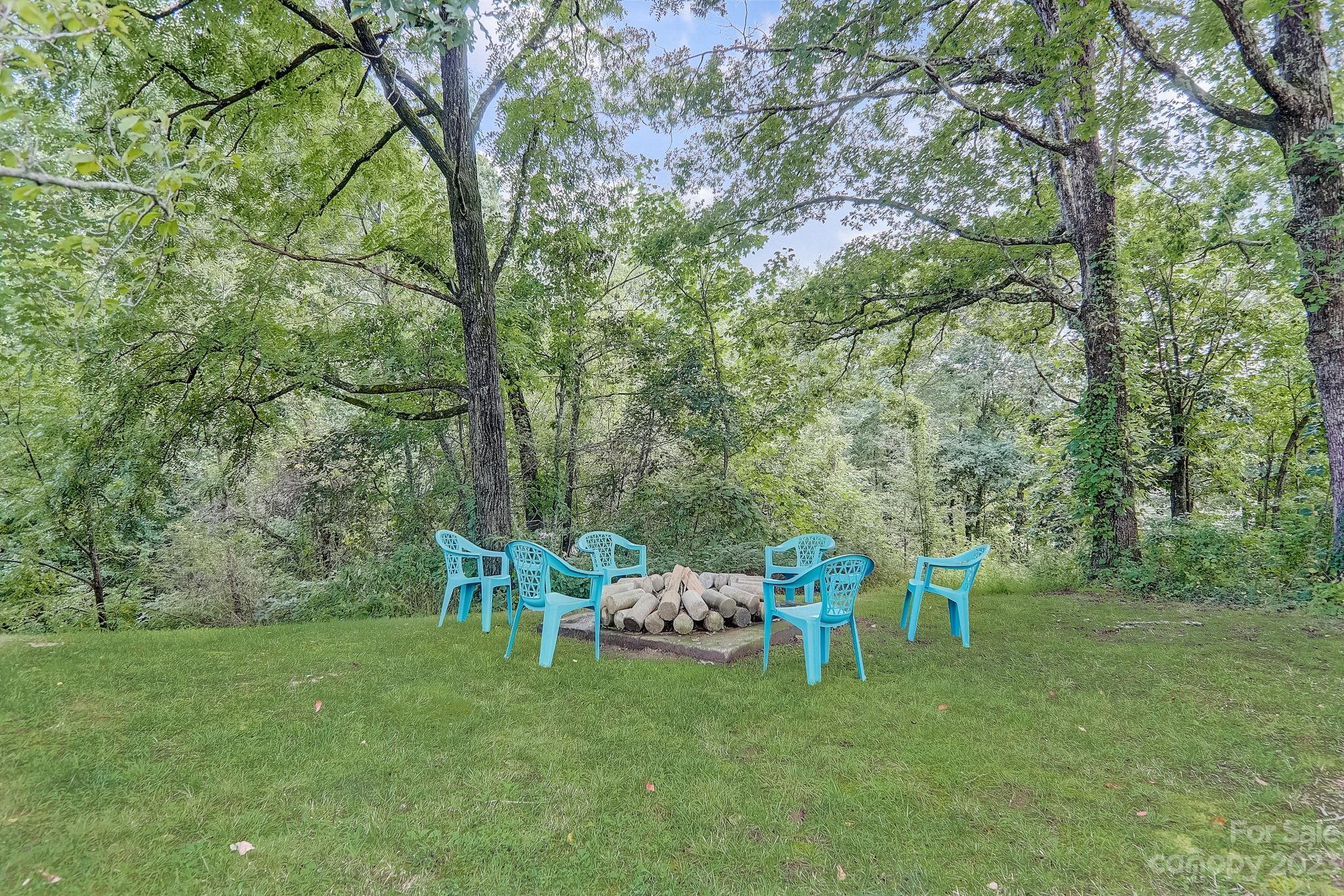 290 Upper Brush Creek Road Fletcher, NC 28732 - Photo 34 of 48 a couple of chairs in a yard
