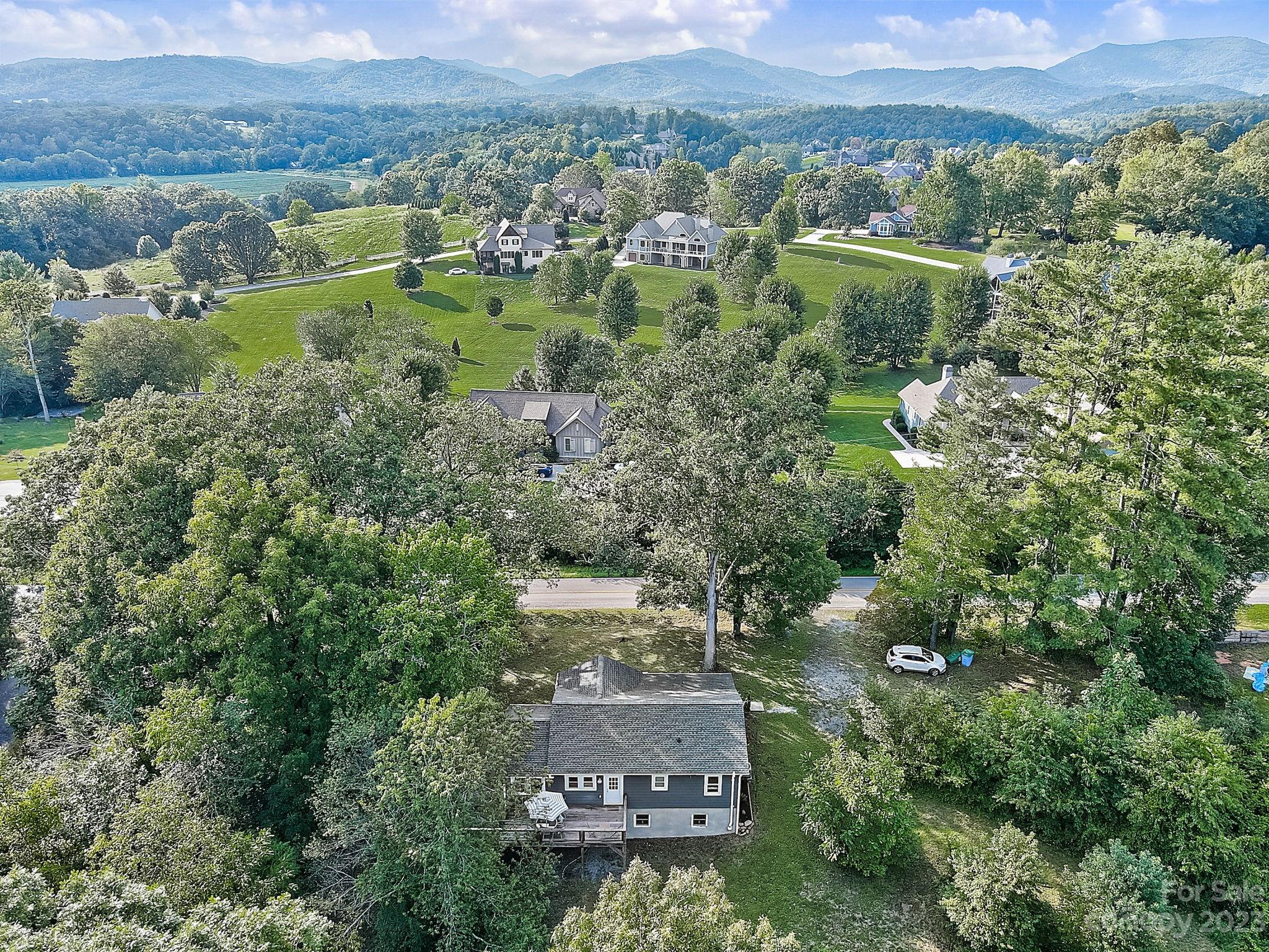 290 Upper Brush Creek Road Fletcher, NC 28732 - Photo 38 of 48 an aerial view of a house with a yard