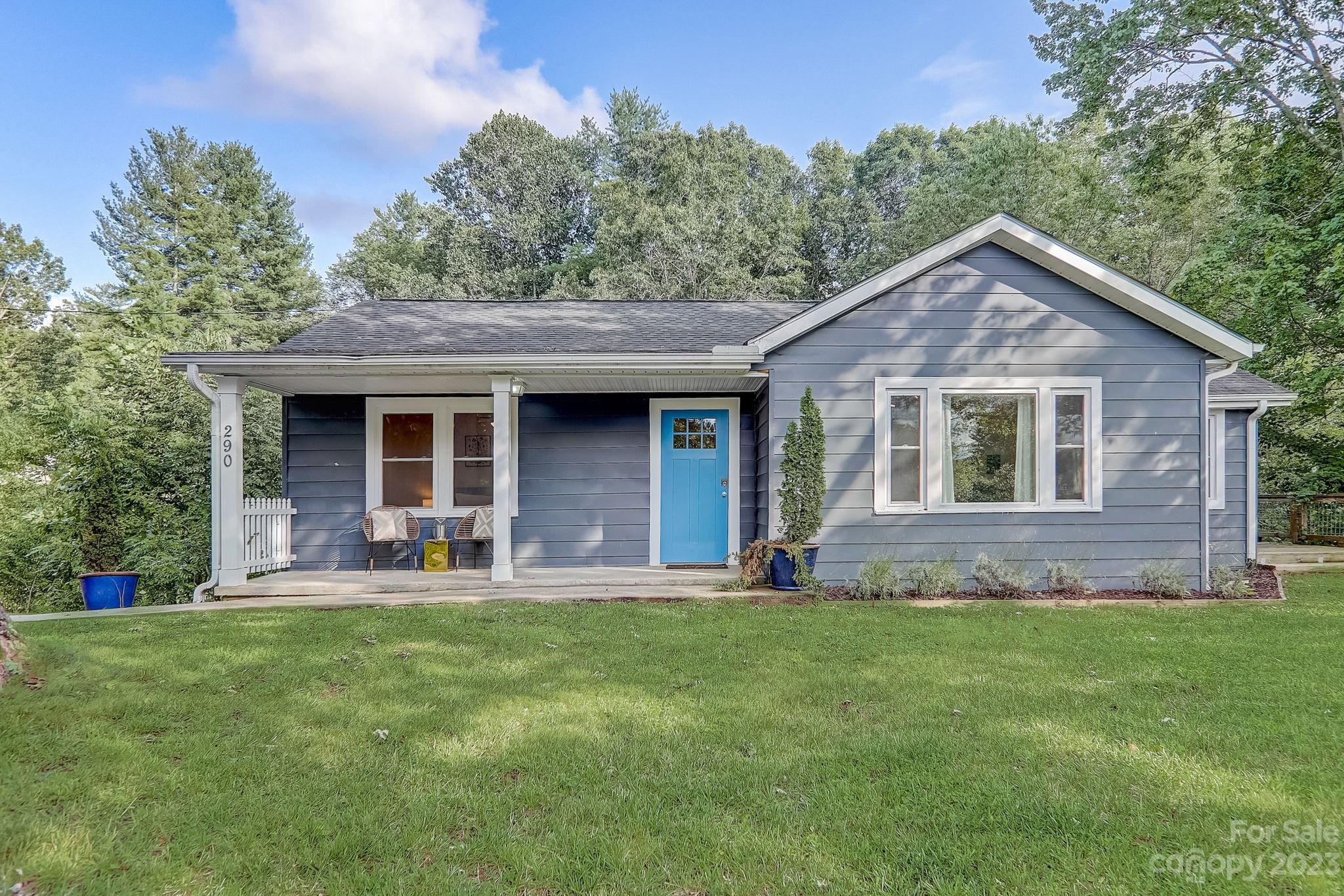 290 Upper Brush Creek Road Fletcher, NC 28732 - Photo 42 of 48 a front view of a house with a yard and porch