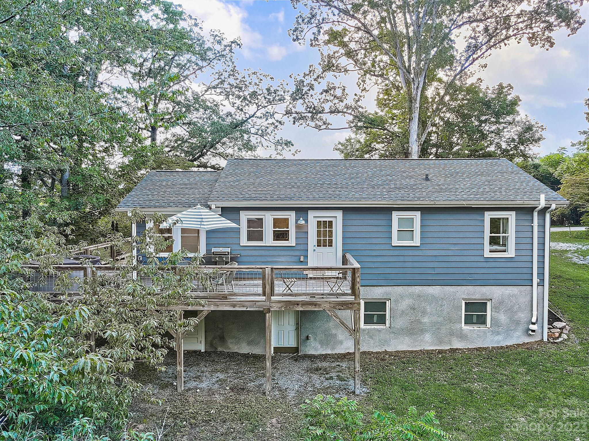 290 Upper Brush Creek Road Fletcher, NC 28732 - Photo 43 of 48 a view of a house with a yard and sitting area