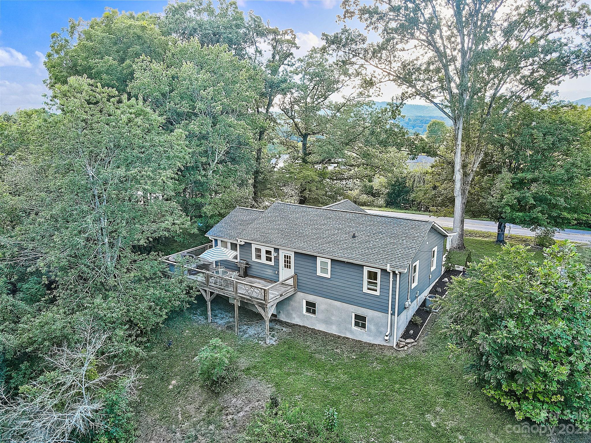 290 Upper Brush Creek Road Fletcher, NC 28732 - Photo 44 of 48 an aerial view of a house with yard and sitting area