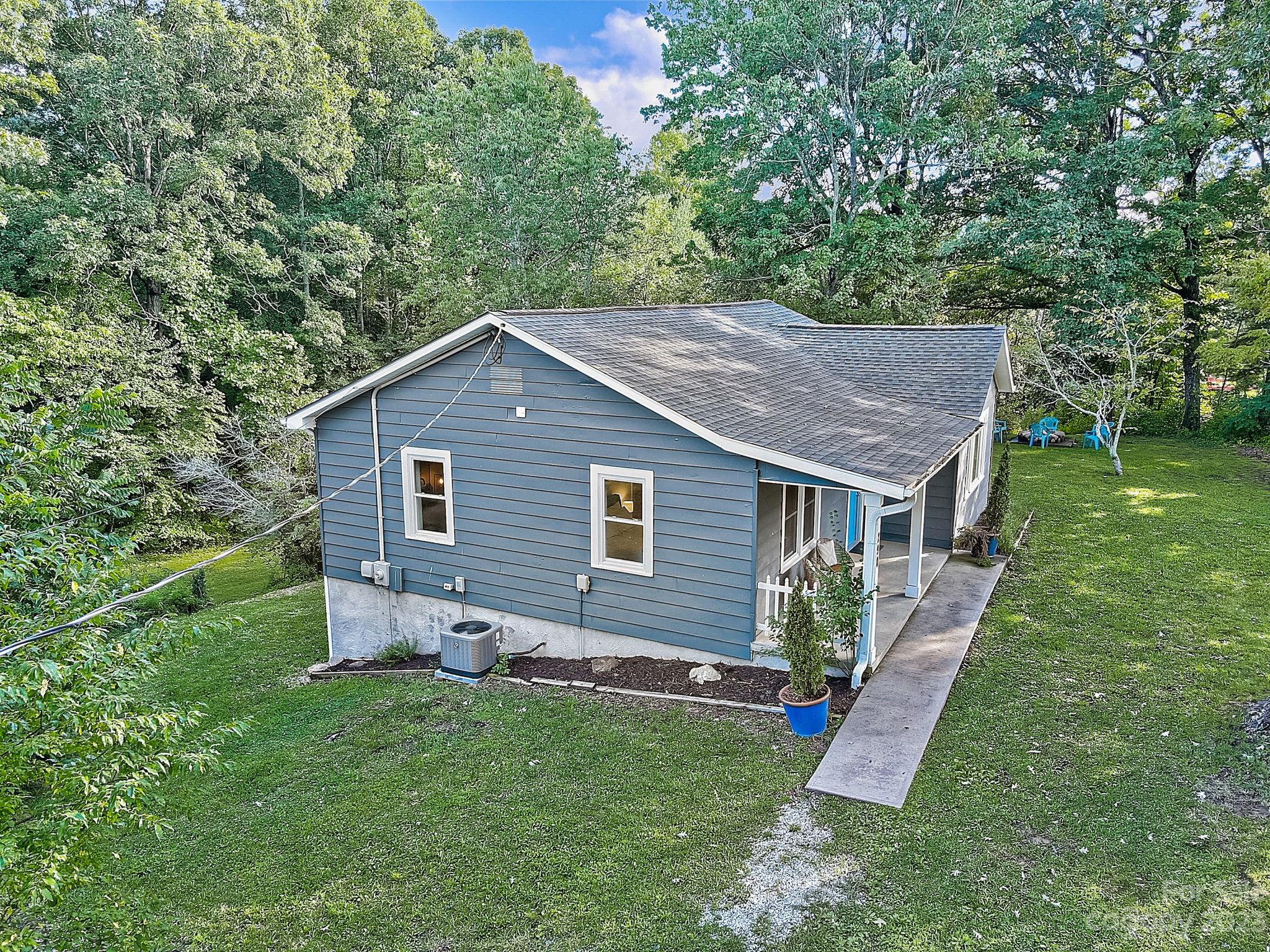 290 Upper Brush Creek Road Fletcher, NC 28732 - Photo 46 of 48 a backyard of a house with seating space
