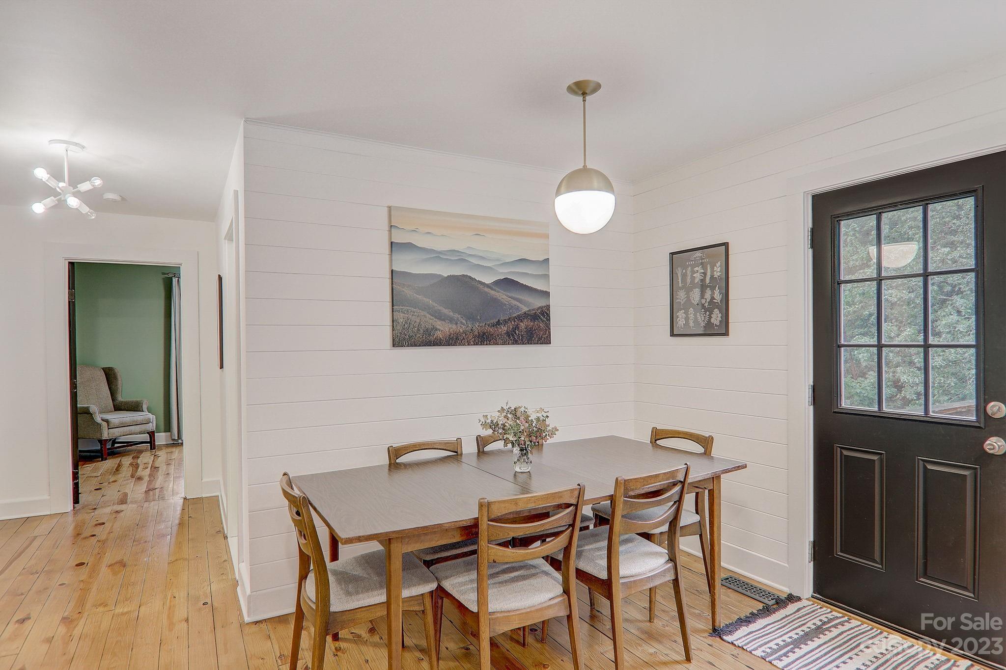290 Upper Brush Creek Road Fletcher, NC 28732 - Photo 9 of 48 a view of a dining room with furniture and wooden floor