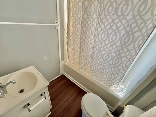 a bathroom with a toilet and shower
