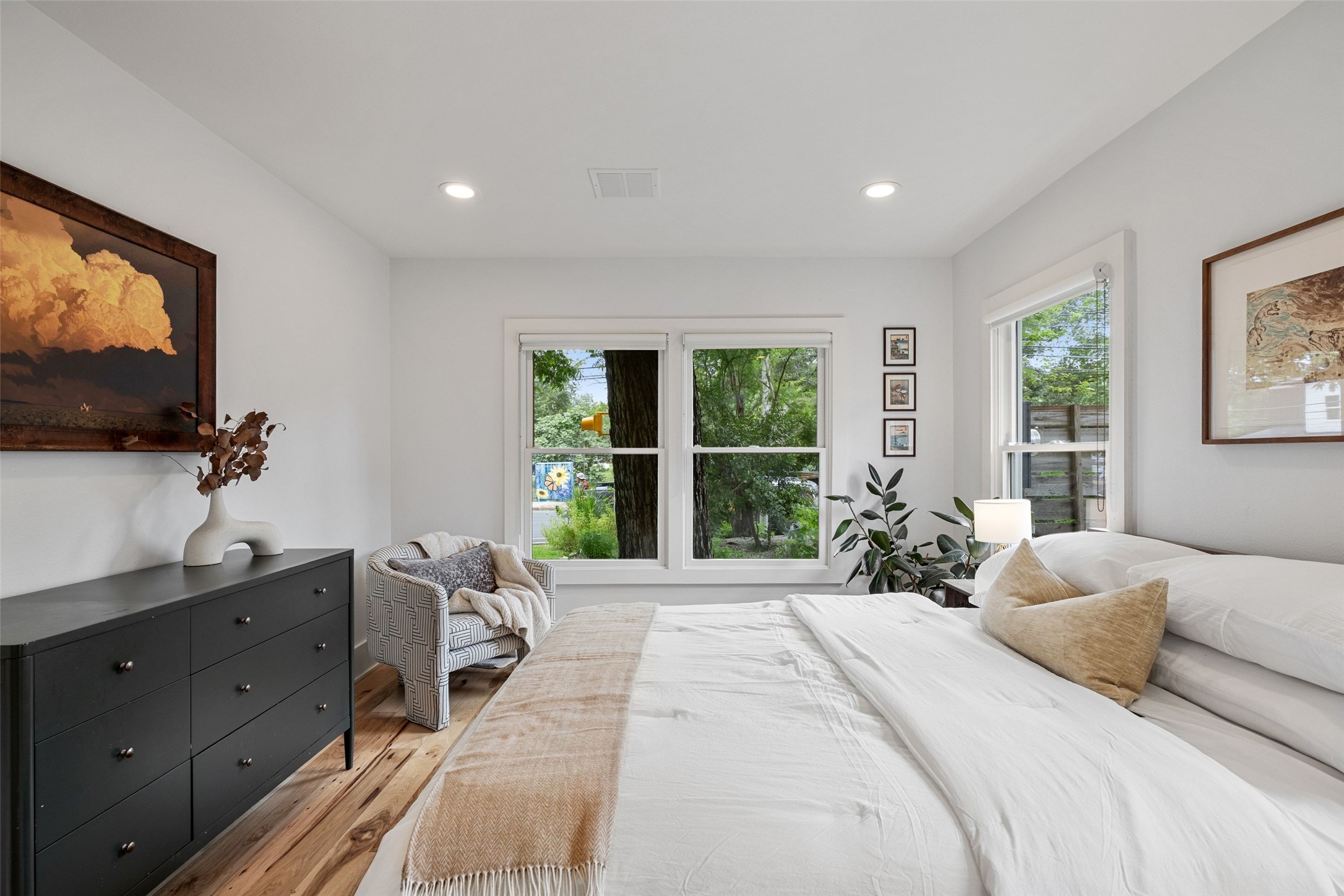2000 Rundell Place Austin, TX 78704 - Photo 27 of 38 Hardwood floors and generous windows illuminate this well-appointed bedroom.