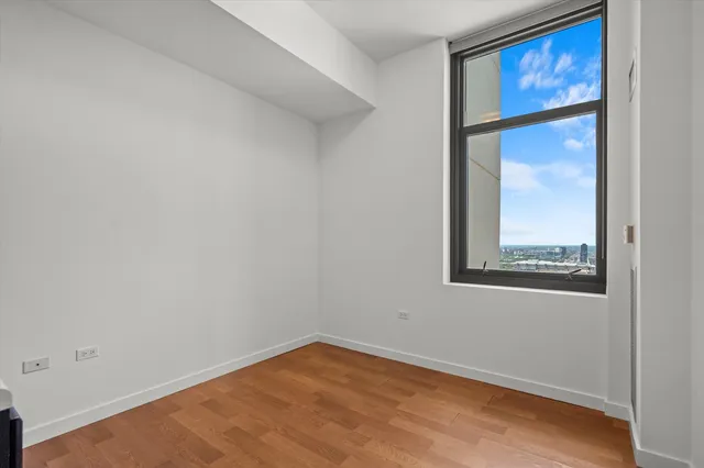 an empty room with wooden floor