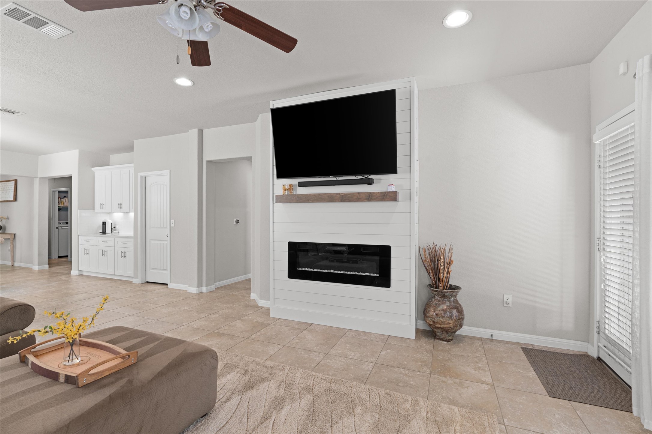 524 Longhorn Cavern Road Leander, TX 78641 - Photo 16 of 34 Living area with ceiling fan, recessed lighting, and a fireplace