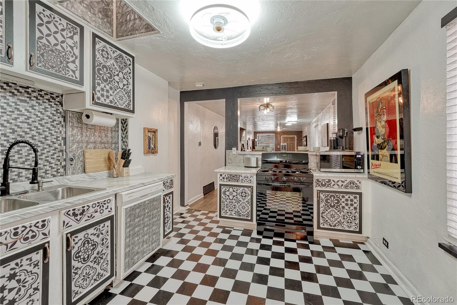 1026 Inca Street Denver, CO 80204 - Photo 12 of 27 a room with lots of wooden furniture and a shower