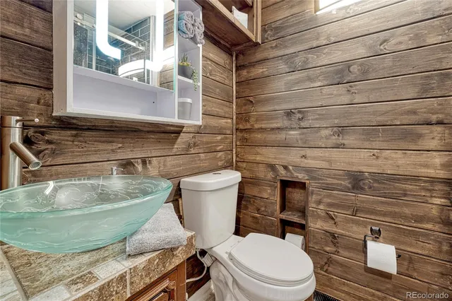 a bathroom with a toilet and a sink
