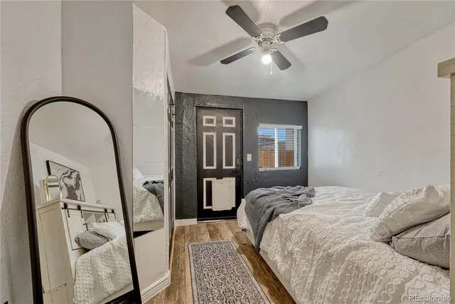 a bed sitting in a bedroom next to a window