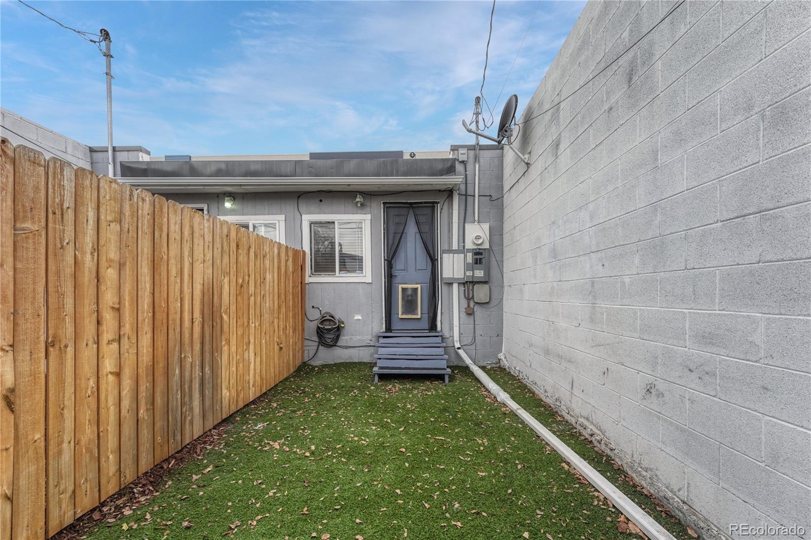 1026 Inca Street Denver, CO 80204 - Photo 24 of 27 a view of a backyard with a garden