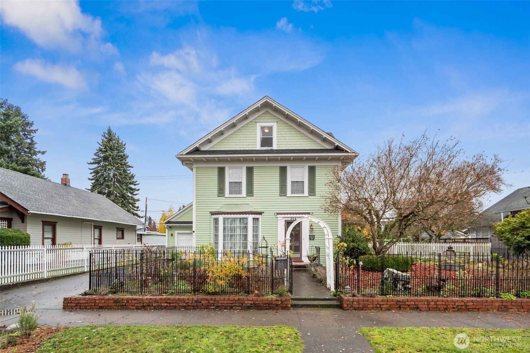 a front view of a house with garden