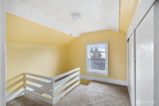 a view of an empty room with a window