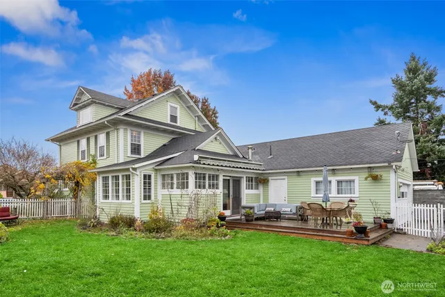 a front view of a house with a garden and patio