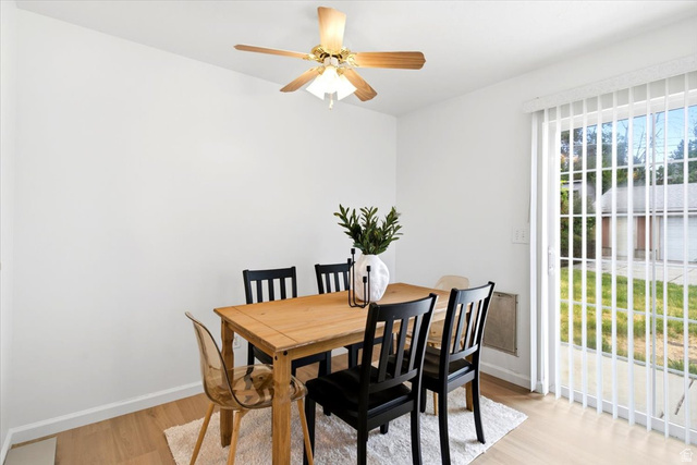 1341 29th Street Ogden, UT 84403 - Photo 8 of 37 Dining area with light wood-finish flooring, white walls, and a ceiling fan with integrated lighting