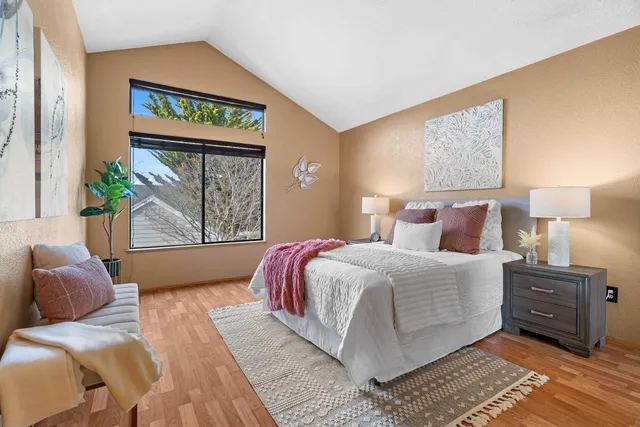 a bedroom with a bed and window