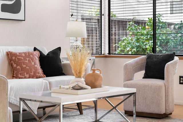 a living room with furniture and a window