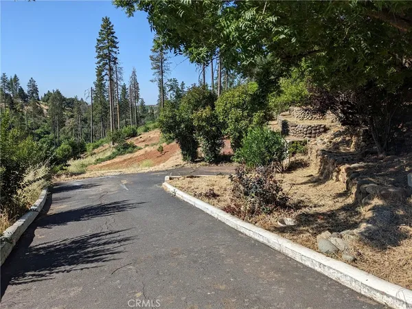 a view of a road with a yard