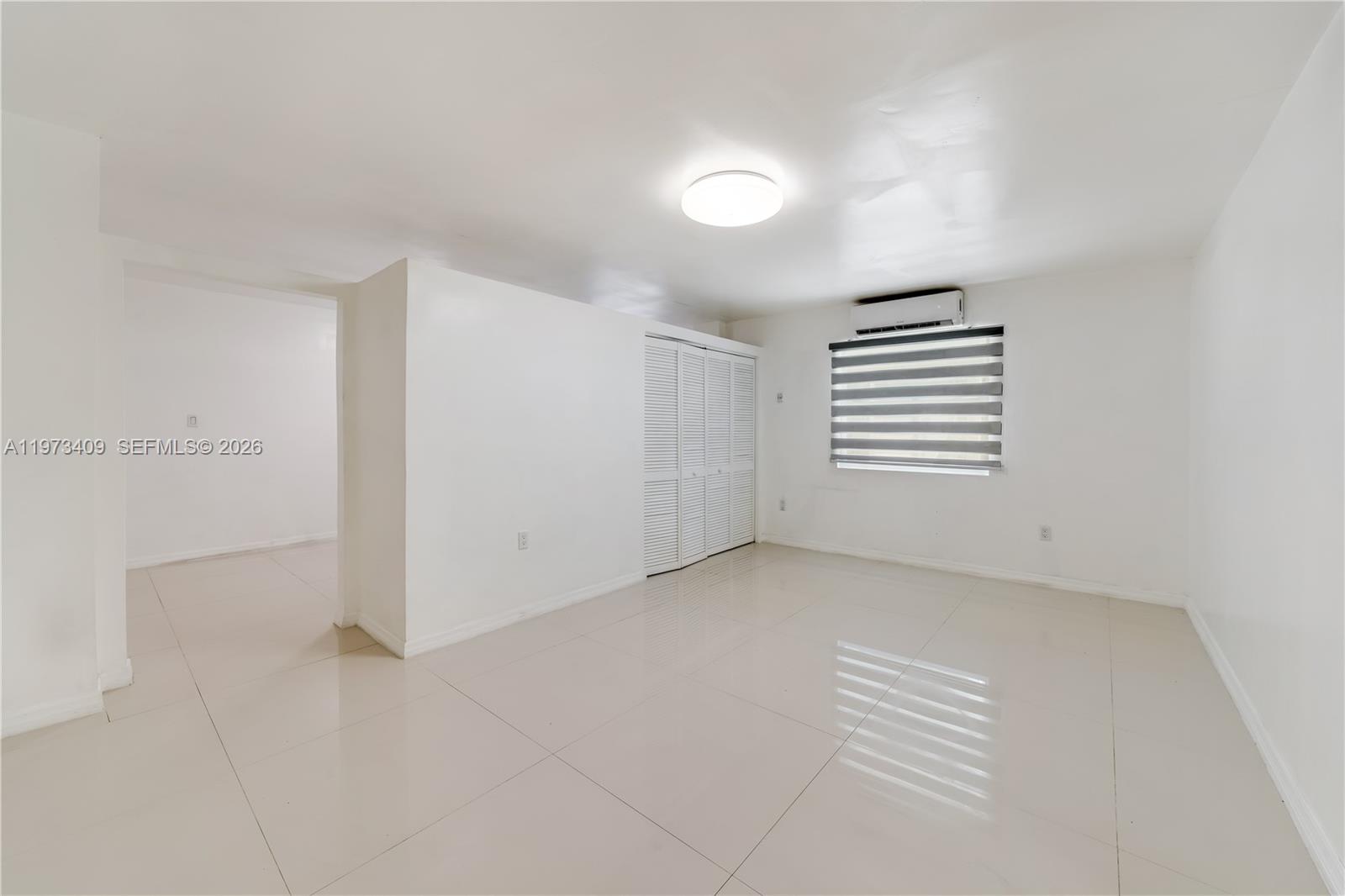 13050 Southwest 26th Street Miami, FL 33175 - Photo 35 of 43 an empty room with windows