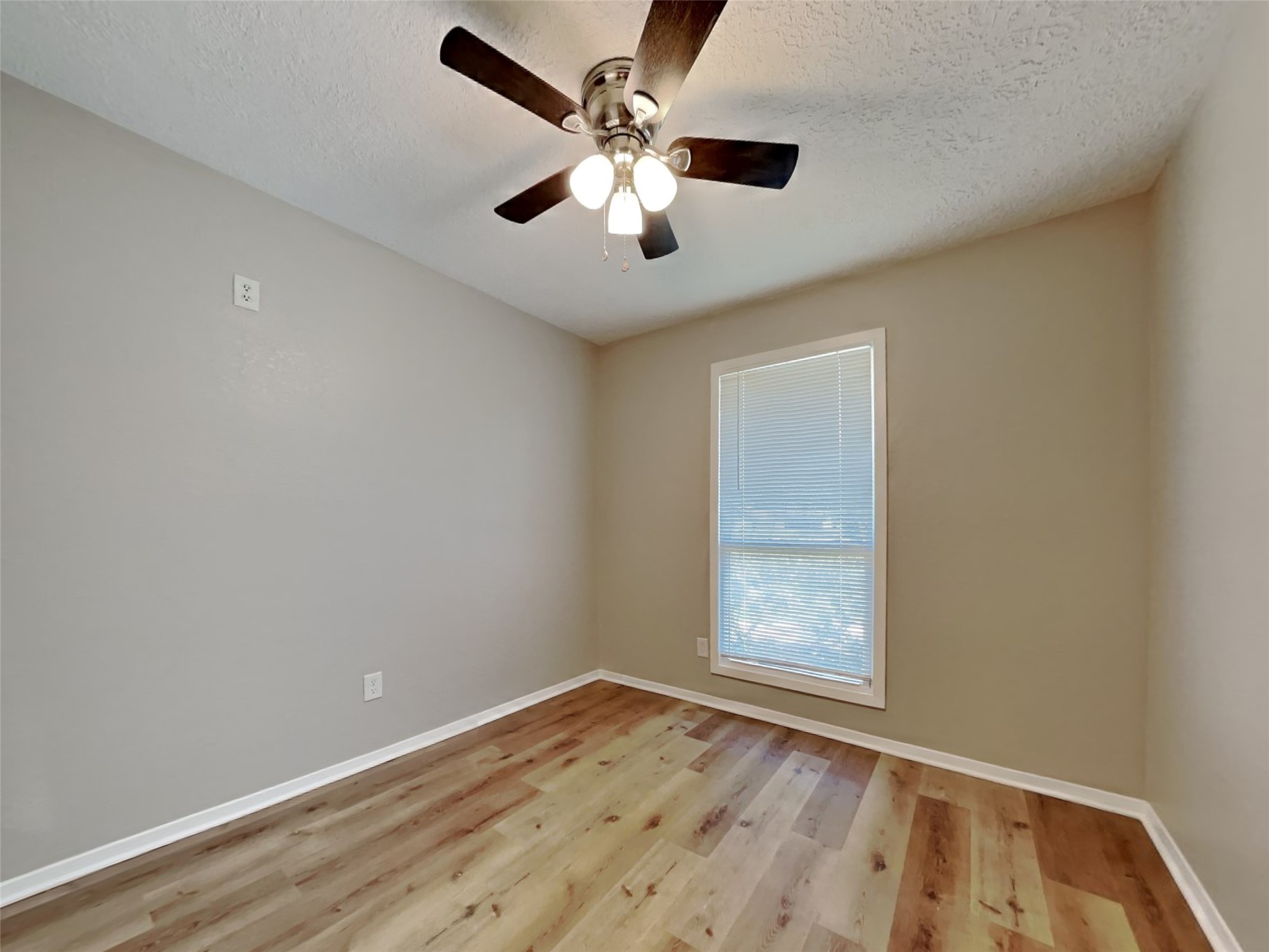 4315 Hirschfield Road Spring, TX 77373 - Photo 14 of 18 an empty room with a window and a ceiling fan