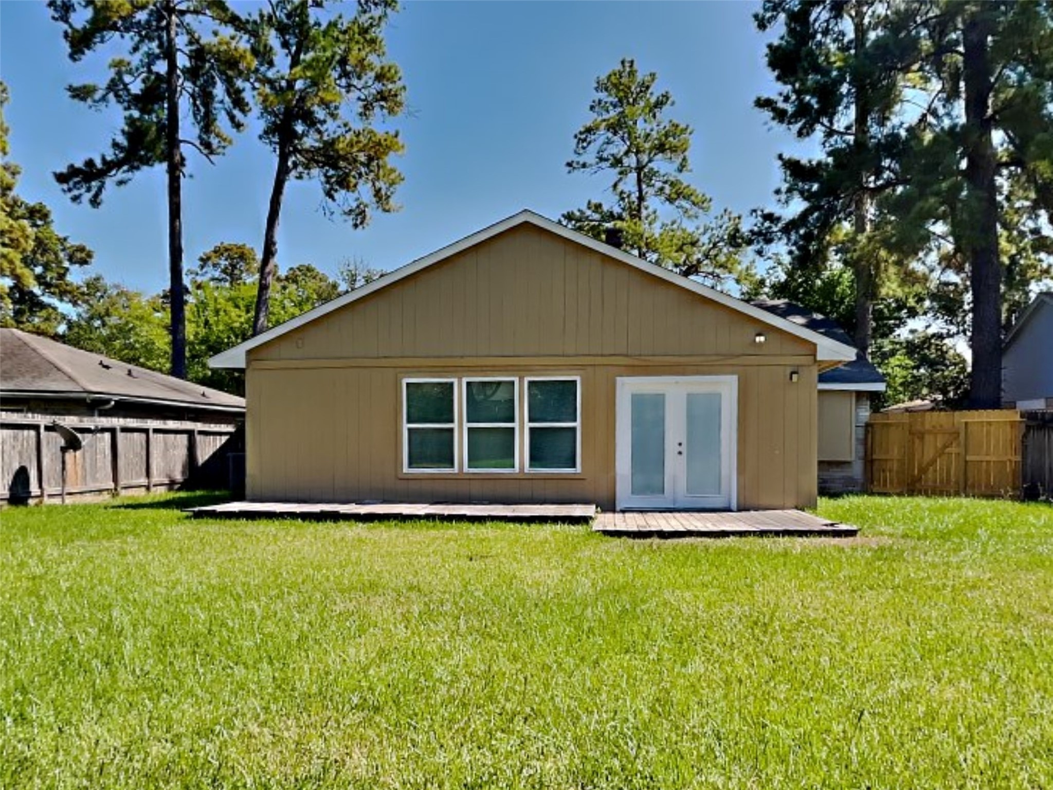 4315 Hirschfield Road Spring, TX 77373 - Photo 17 of 18 a house that has a big yard with large trees