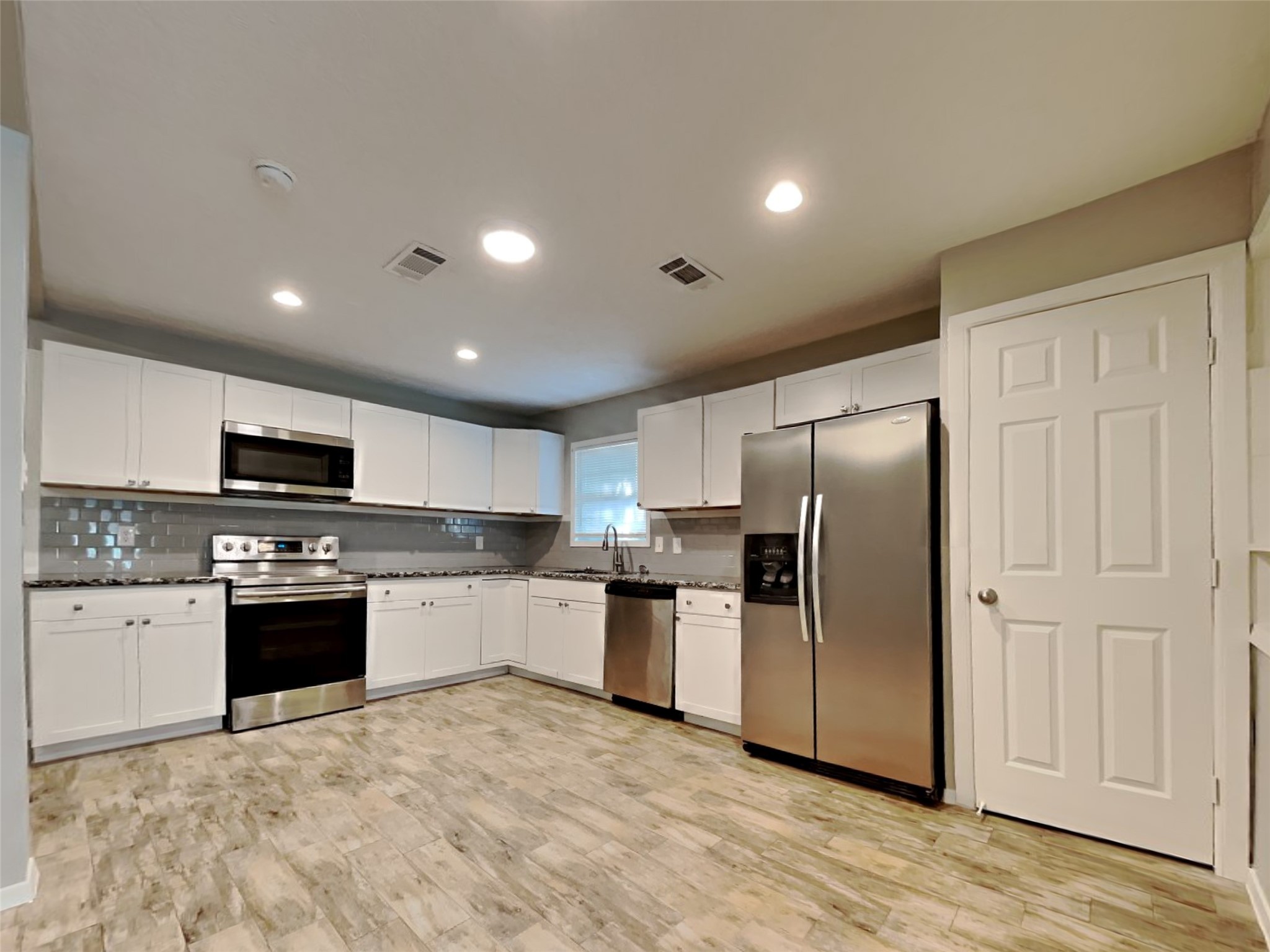 4315 Hirschfield Road Spring, TX 77373 - Photo 5 of 18 a kitchen with stainless steel appliances granite countertop a refrigerator sink and stove