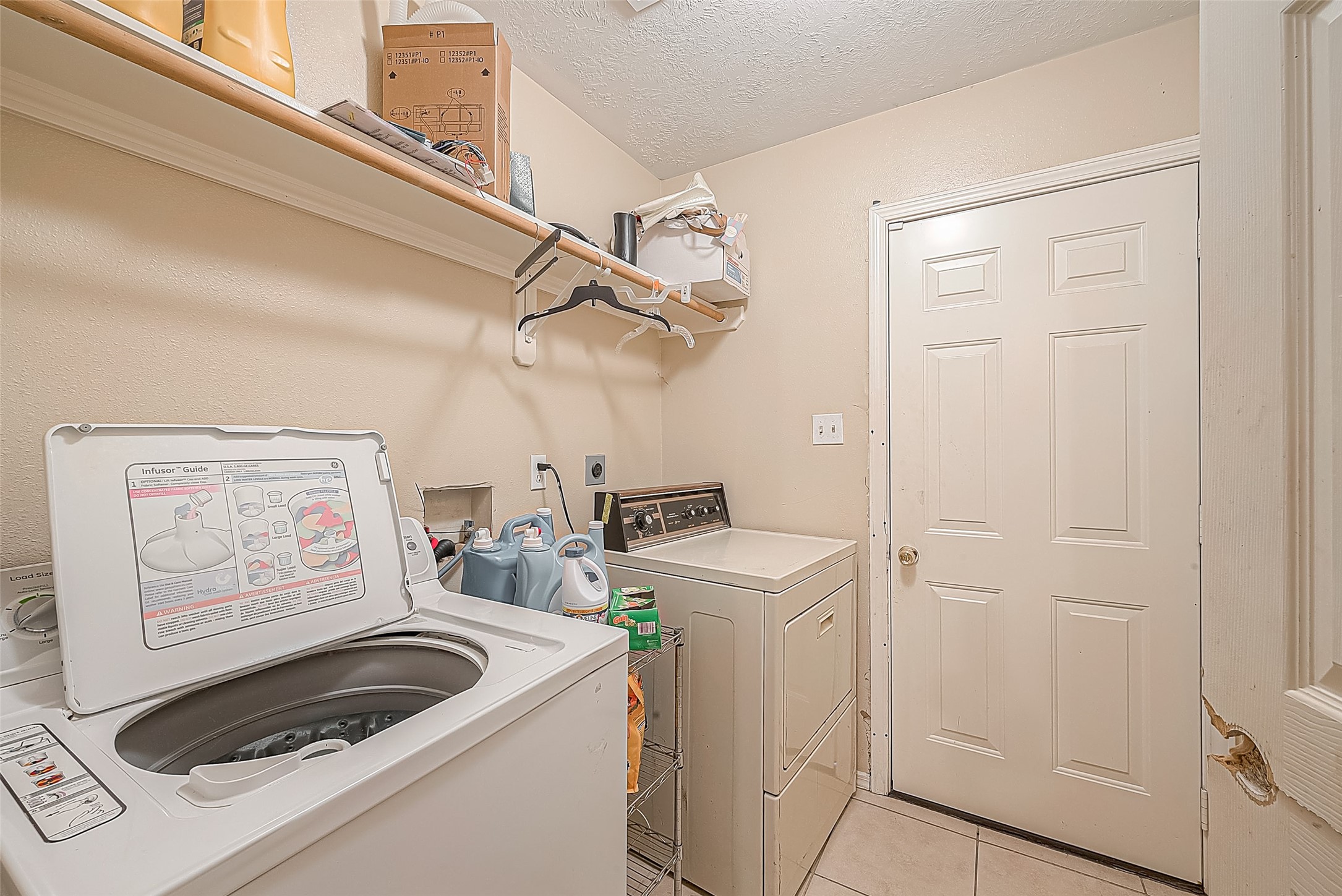 944 Dewalt Street Houston, TX 77088 - Photo 11 of 17 a kitchen with a refrigerator and a stove