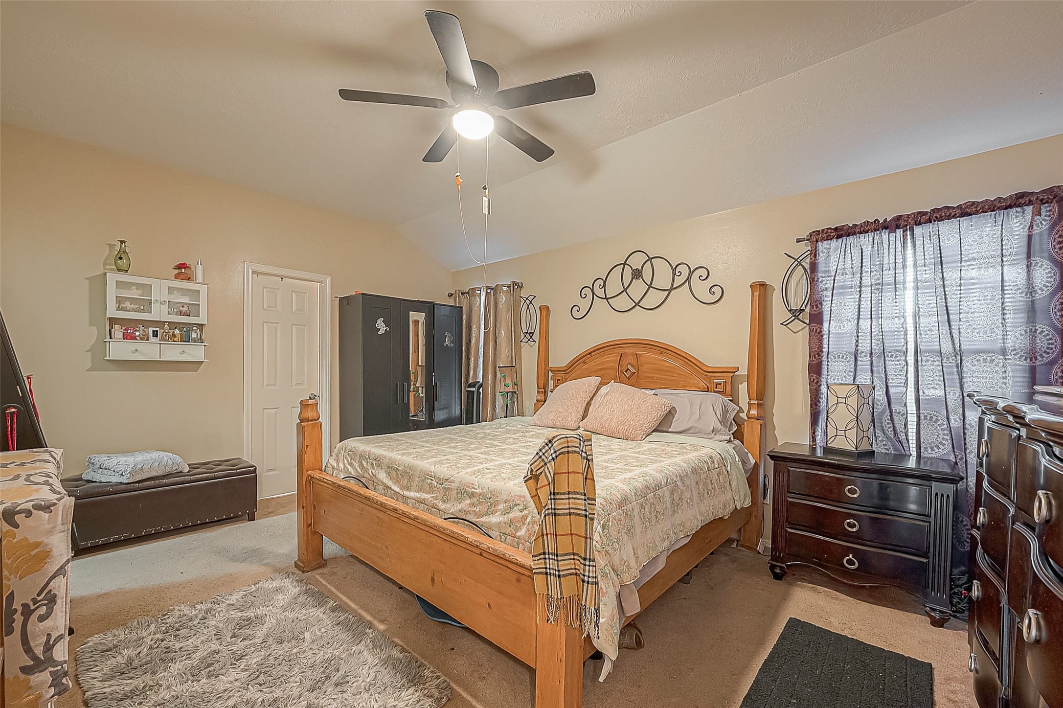 944 Dewalt Street Houston, TX 77088 - Photo 15 of 17 a bedroom with a bed and a flat tv screen on dresser