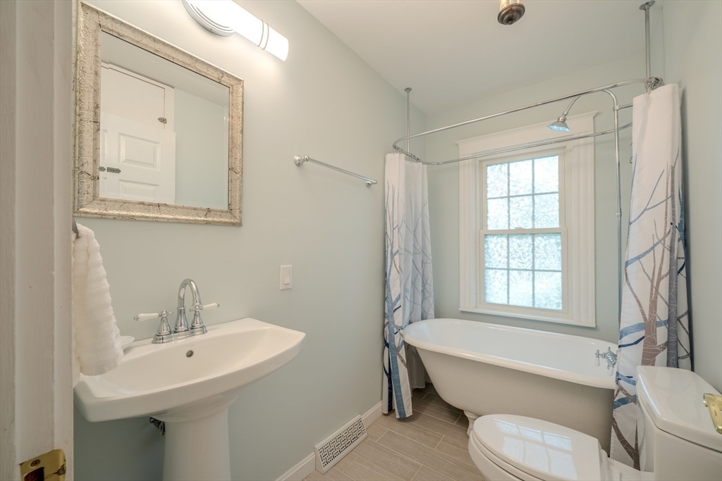 11 Lakeside Road Billerica, MA 01821 - Photo 16 of 38 a bathroom with a sink toilet and shower